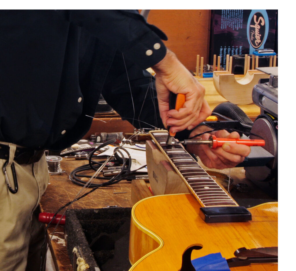 This image has an empty alt attribute; its file name is guitrepair-2-1024x938.jpg
